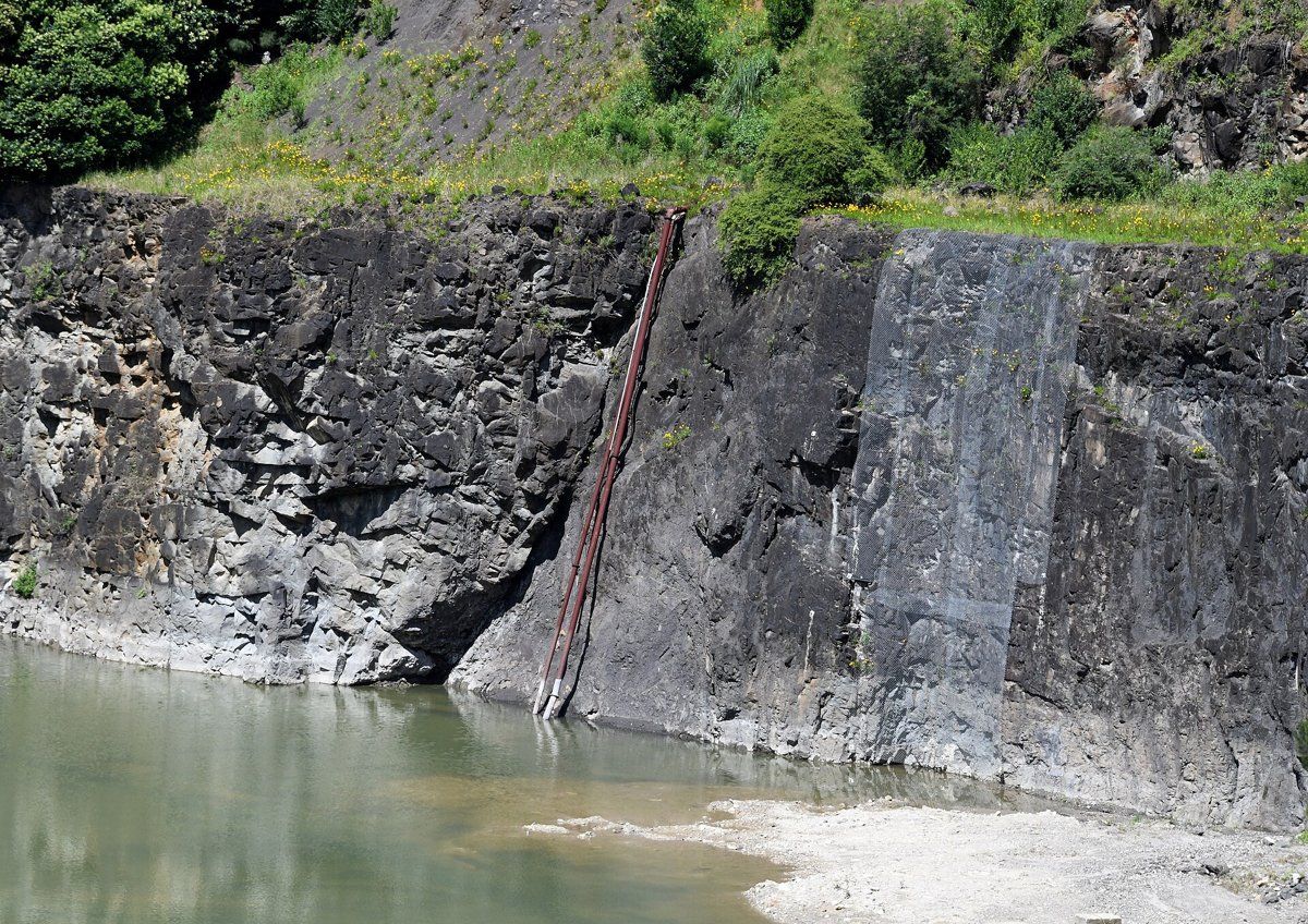 The deep former Hornsby Quarry in Old Mans Valley, with a pool at the bottom
